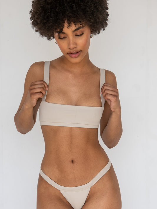 Sleek and modern bikini top in warm earth tones, perfect for summer.