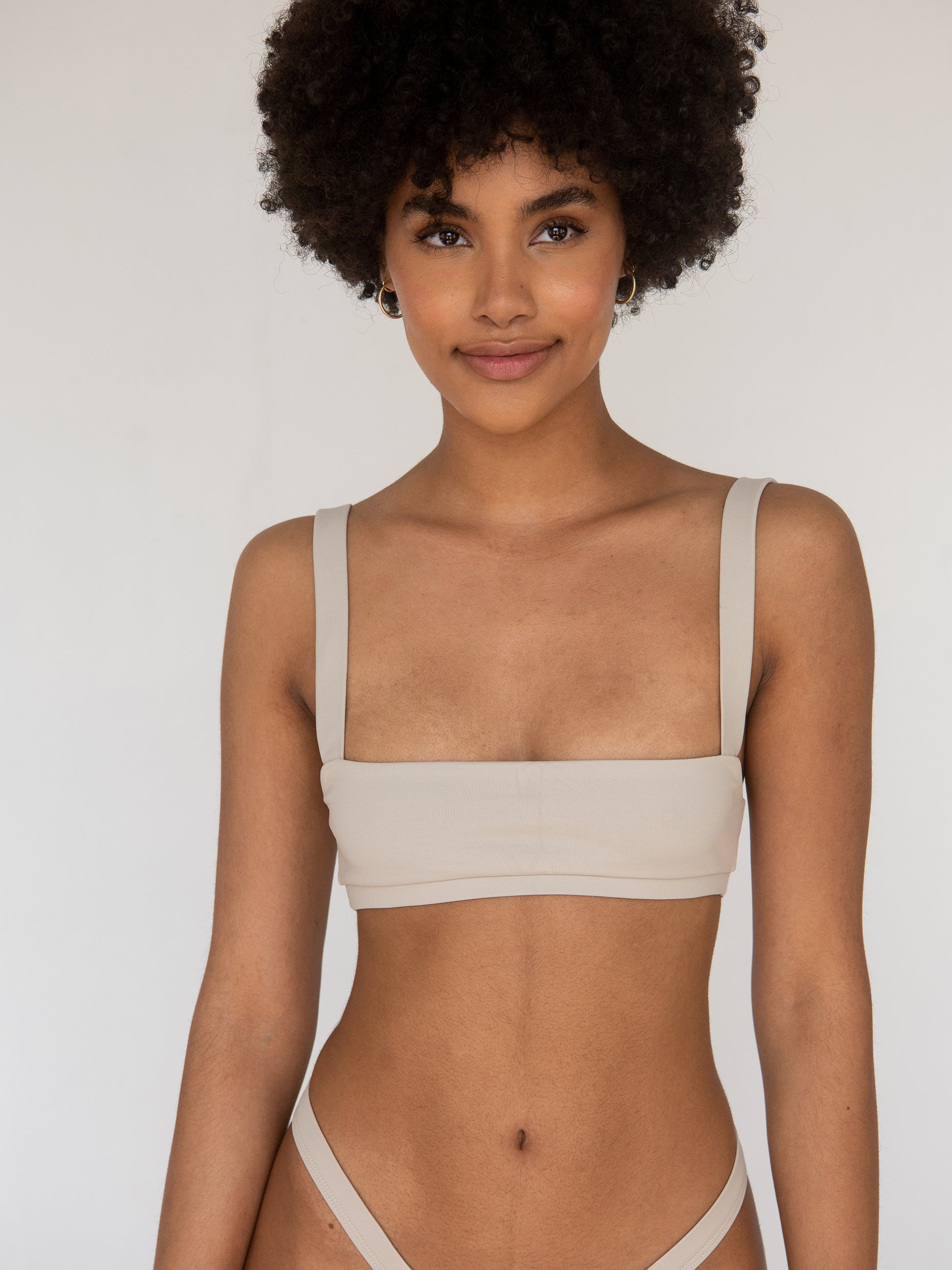 Adjustable strap detail on the Rei Bikini Top for a customized fit.
